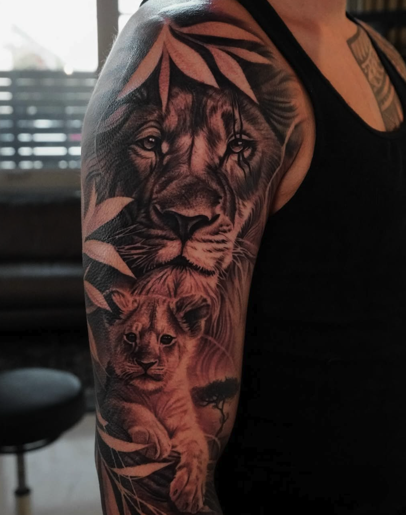 lion realism style tattoo by De'vonne Foxworth