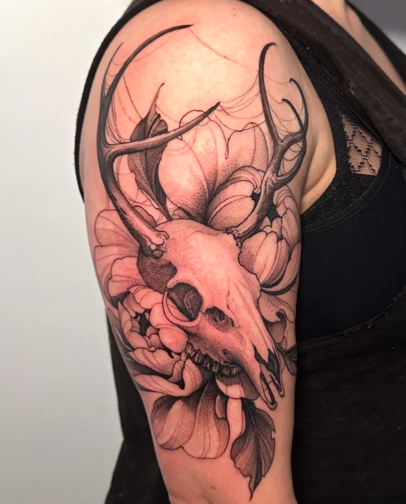 skull black and gray style tattoo by Strokin Dark