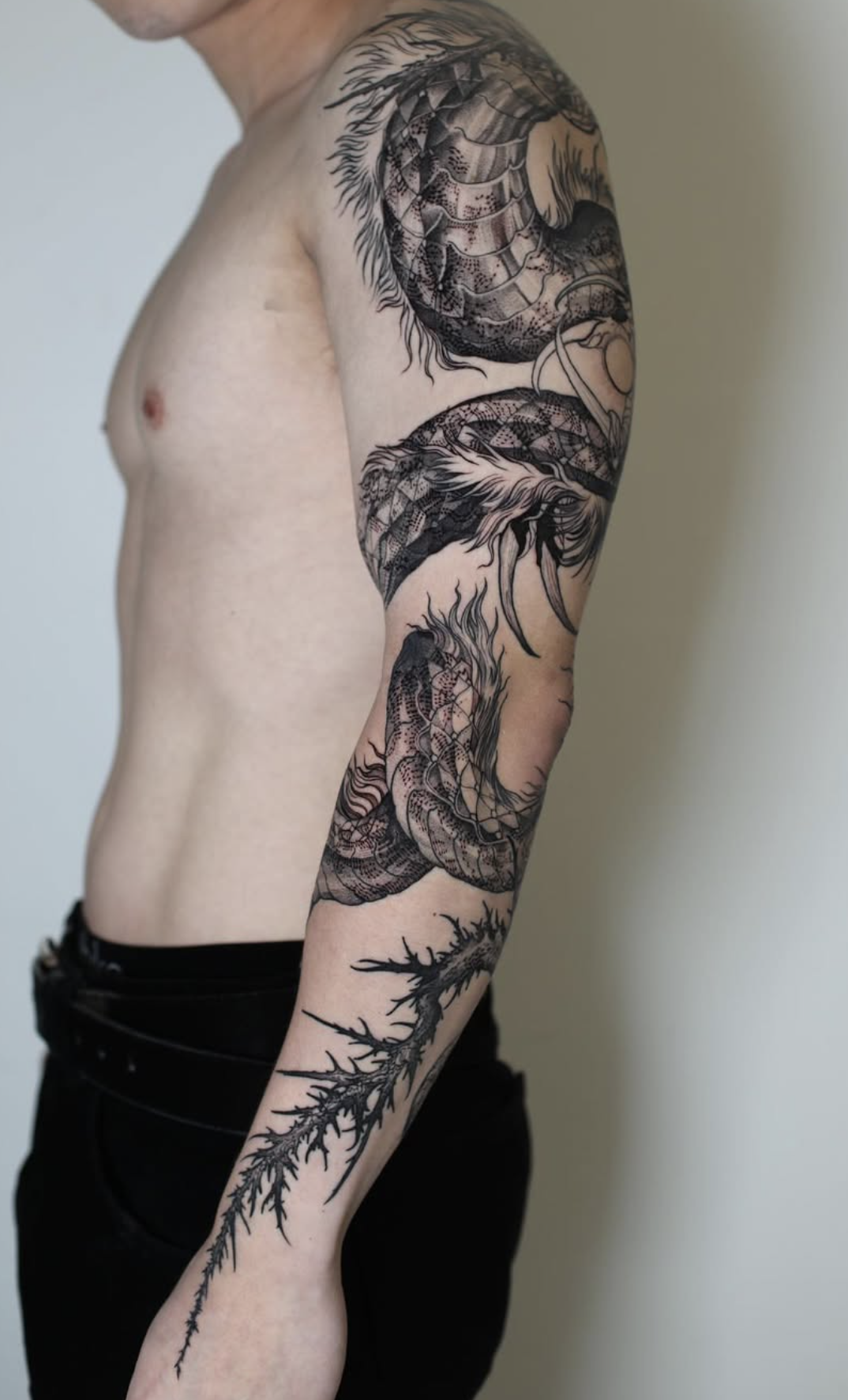 black and gray style tattoo by Strokin Dark