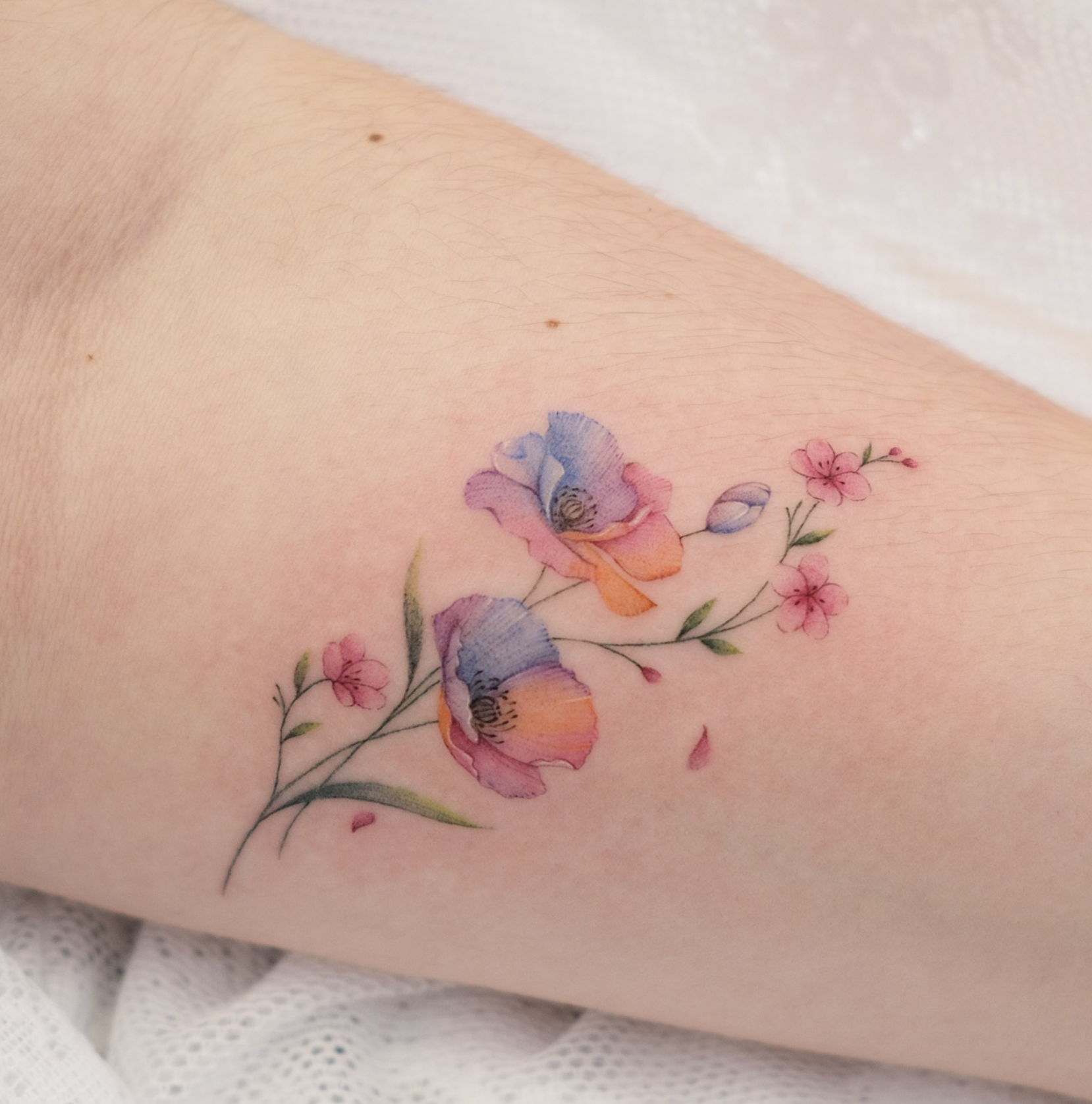 watercolor style tattoo by Tina Choi