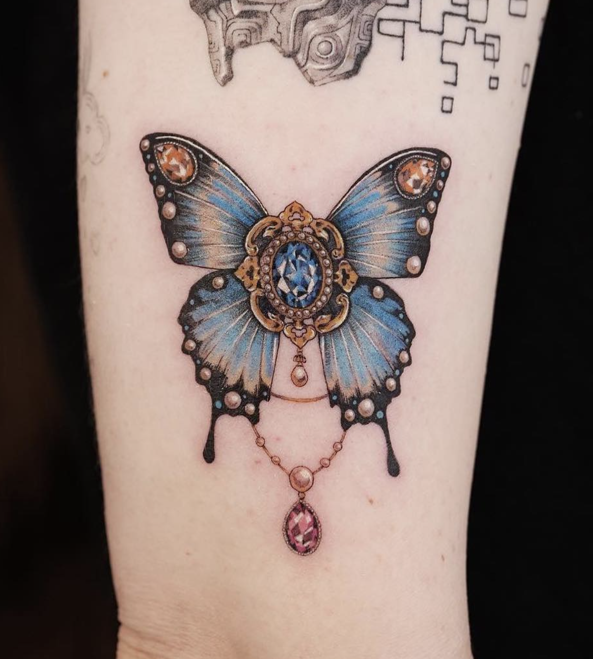 butterfly and gemstone realism style tattoo by Fish