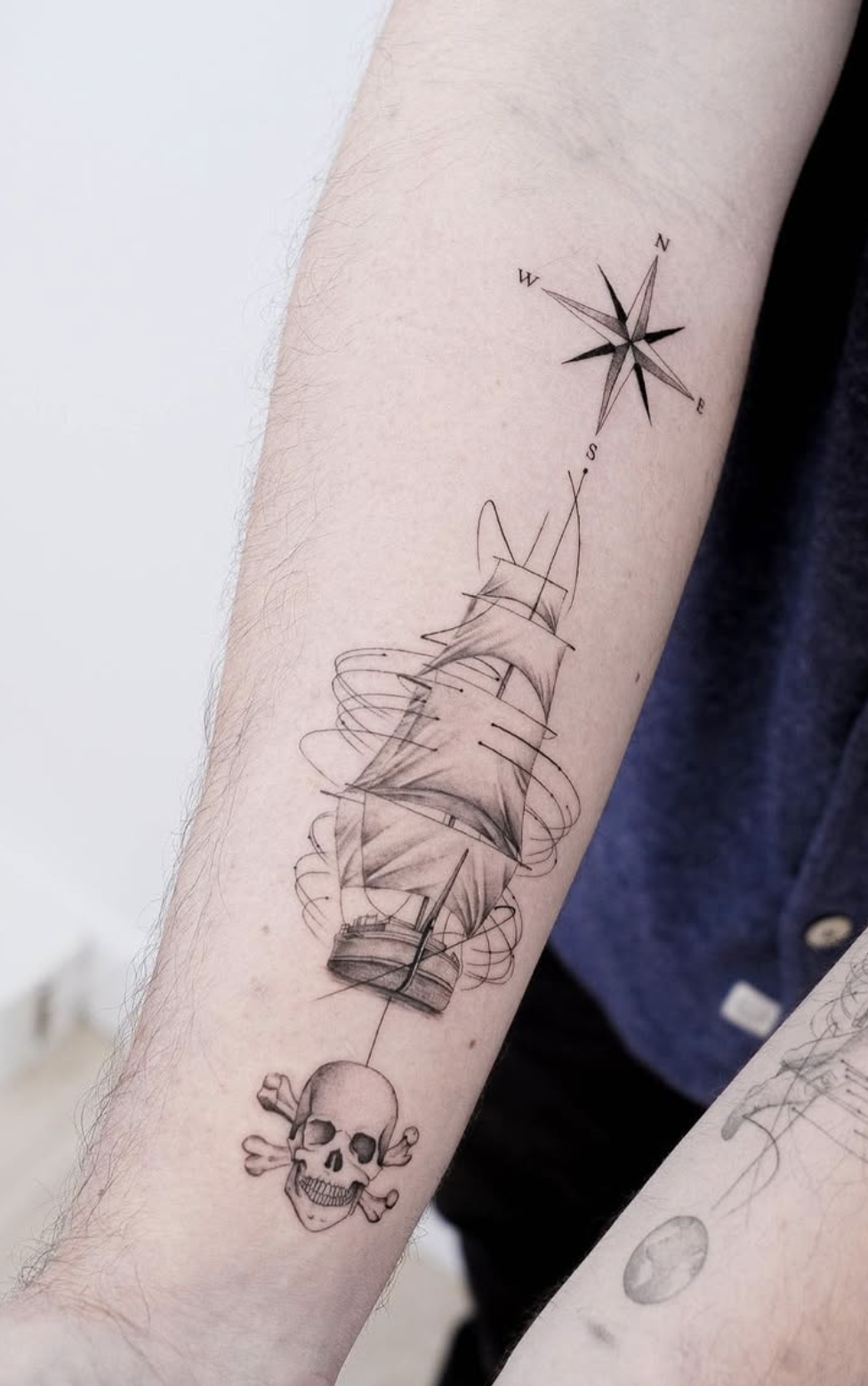 skull black and gray style tattoo by Niko