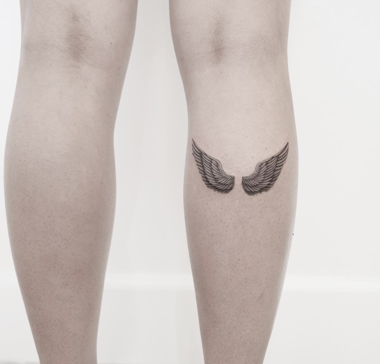 wing linework style tattoo by Niko