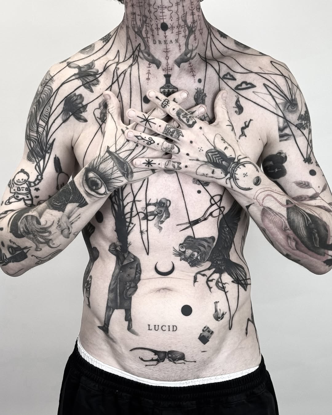 plant and cloud blackwork style tattoo by Matteo Nangeroni