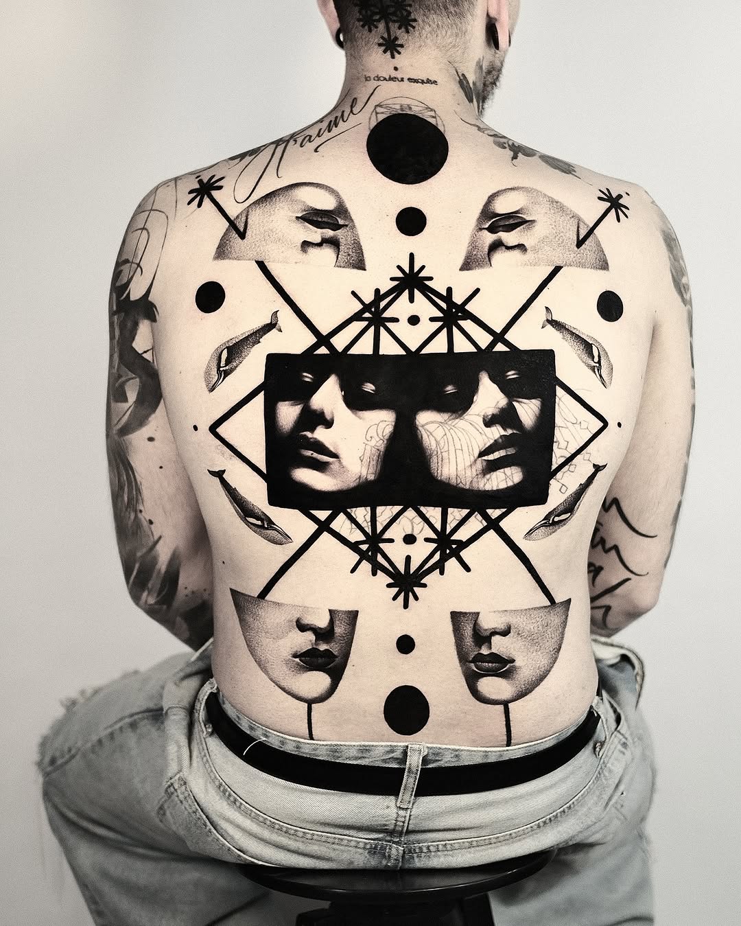 geometric shape and circle blackwork style tattoo by Matteo Nangeroni