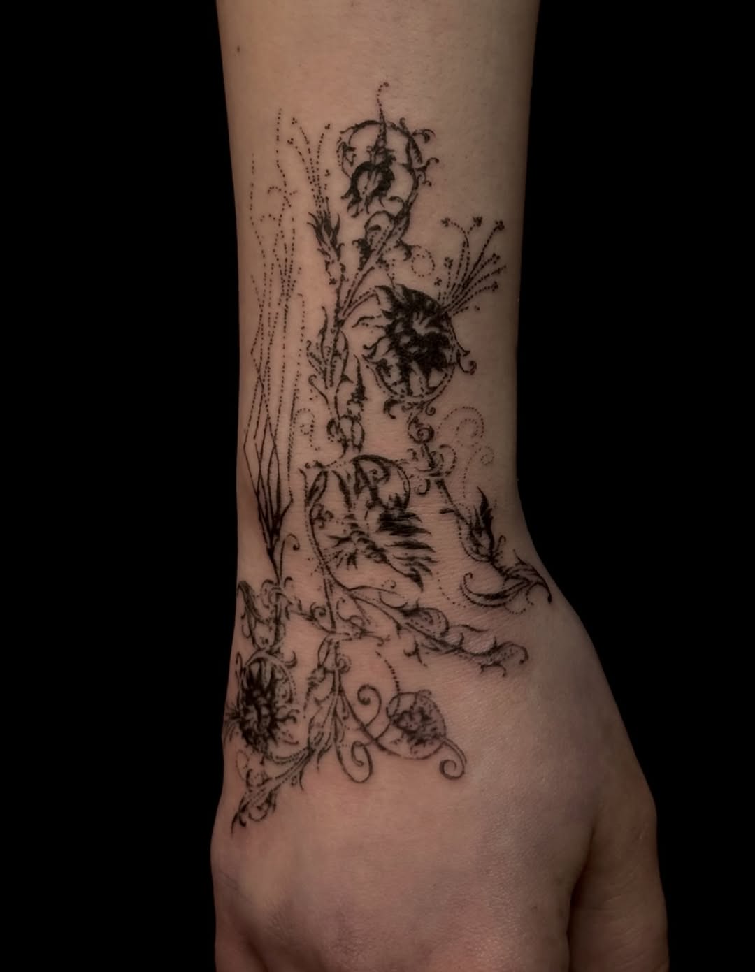 vine and flower blackwork style tattoo by Lauren Kerr