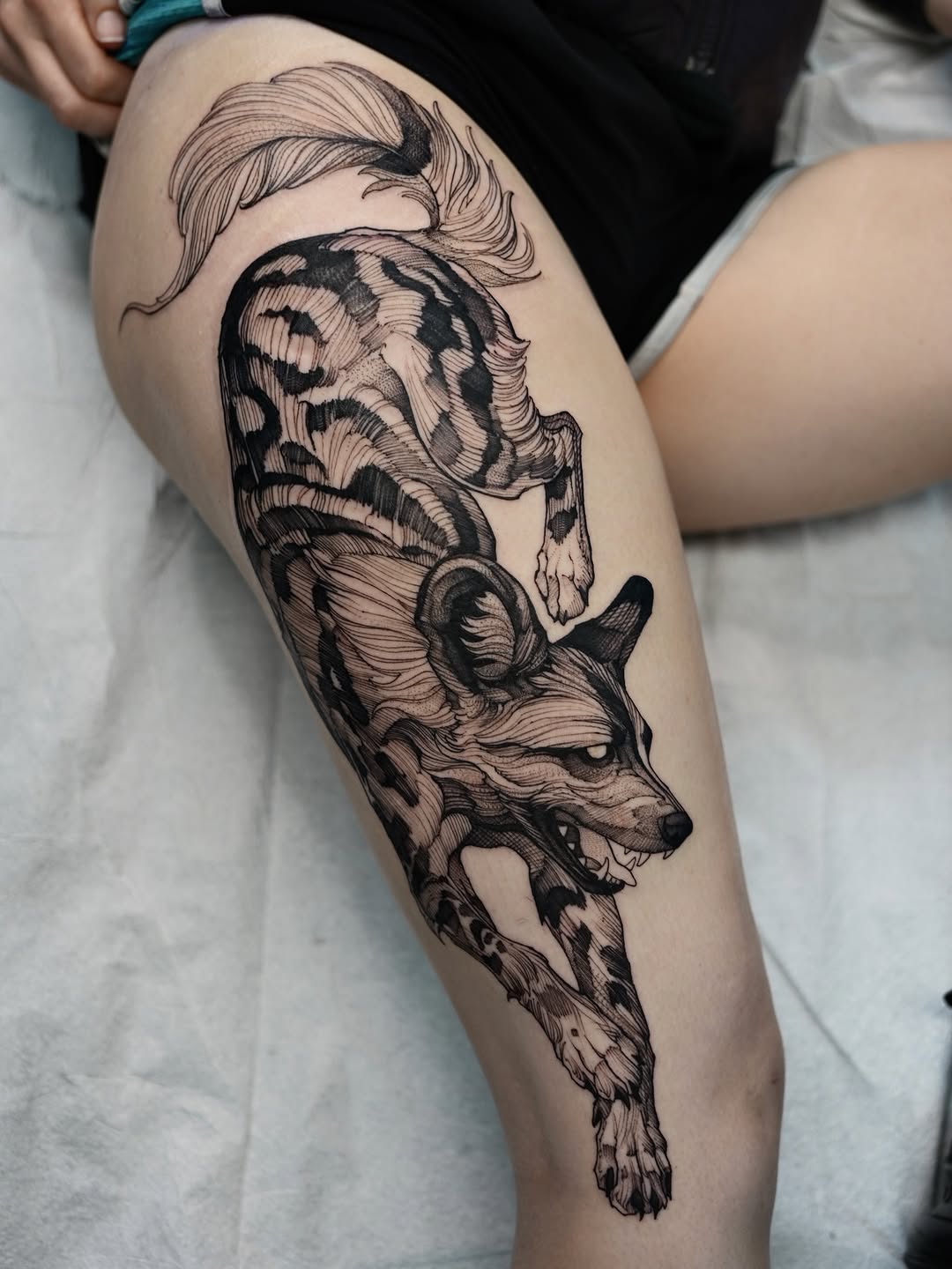 african wild dog and animal blackwork style tattoo by Fredão Oliveira