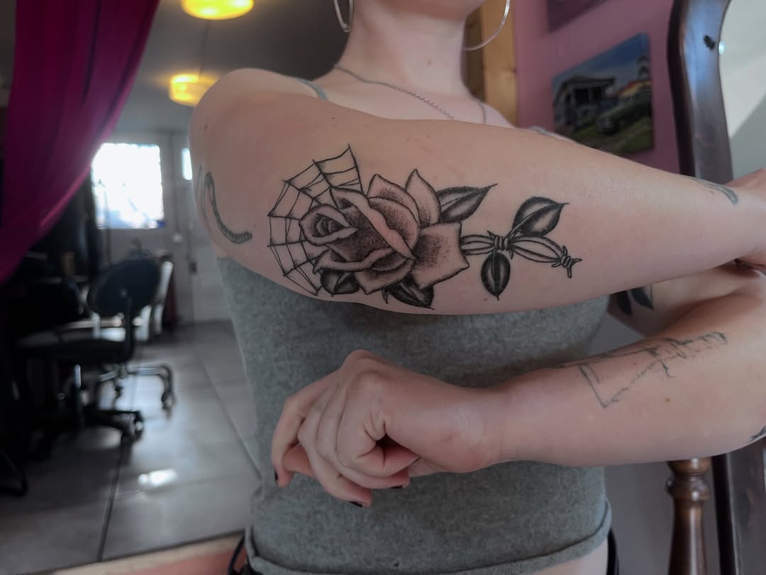 spiderweb and leaf traditional style tattoo by Daisy