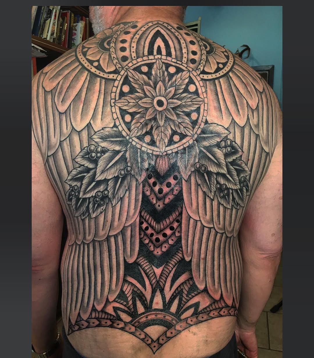 mandala and flower ornamental style tattoo by Jesse Tuesday