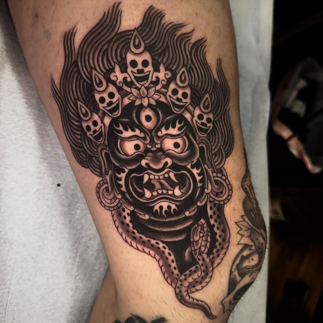 Wrathful mask with flaming hair and snake