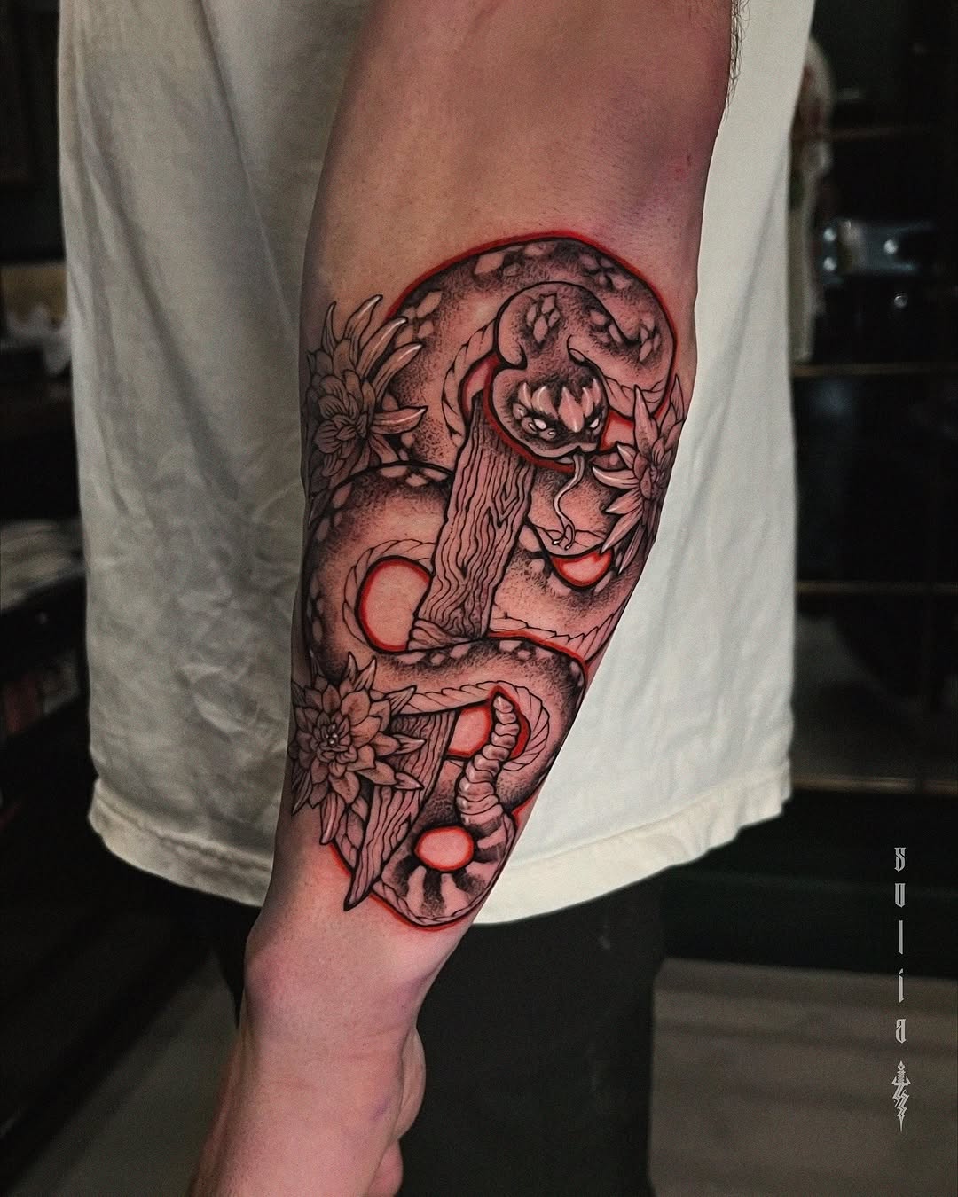 flower and snake blackwork style tattoo by Patrick