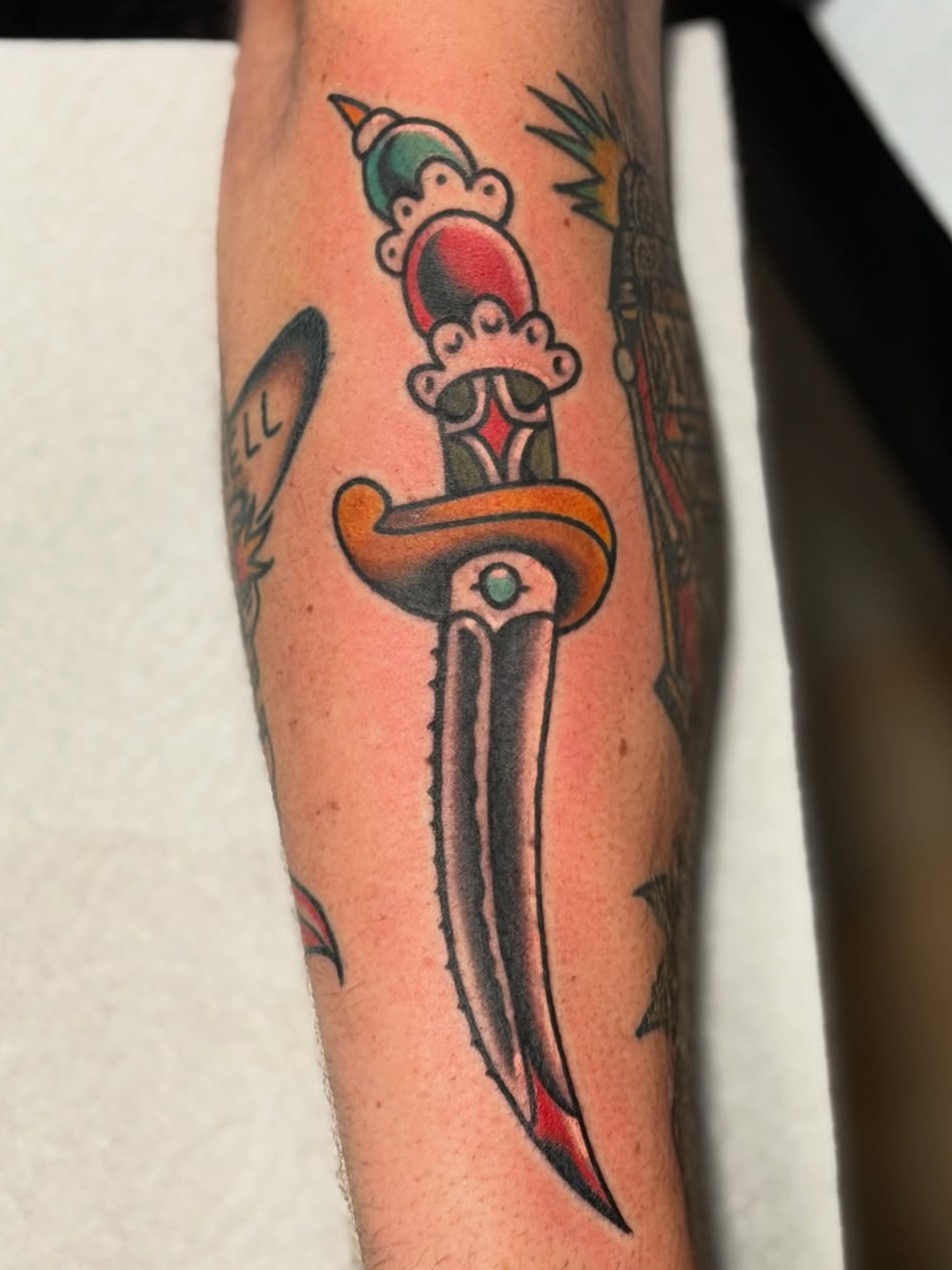 weapon and dagger traditional style tattoo by Johnnyray